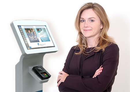 A woman stands in front of an Human Resources - HR kiosk